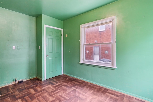 empty room featuring baseboards