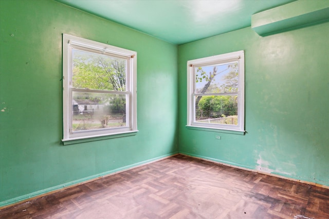 empty room with baseboards