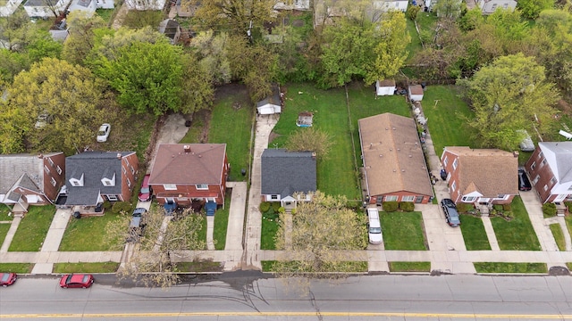 aerial view of property and surrounding area featuring nearby suburban area