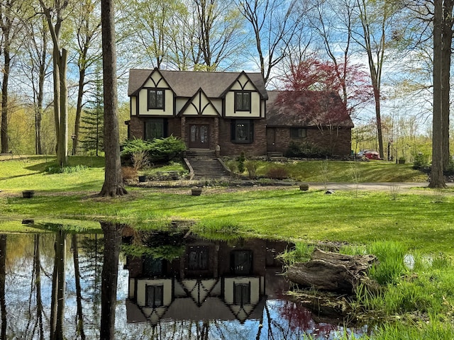 55535 Woody Ln, South Lyon, MI 48178 - english style home with brick siding and a front lawn