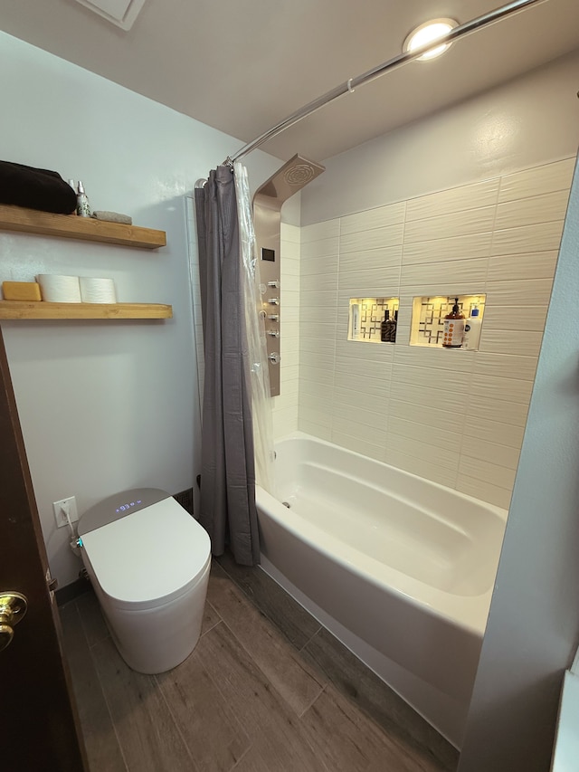 55535 Woody Ln, South Lyon, MI 48178 - bathroom featuring wood finished floors, shower / bath combo, and toilet