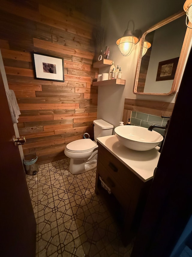 55535 Woody Ln, South Lyon, MI 48178 - bathroom featuring toilet, wooden walls, and vanity