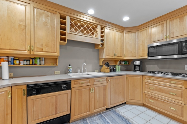 kitchen featuring a sink, paneled dishwasher, open shelves, and stainless steel microwave