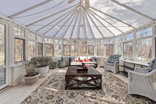 sunroom / solarium featuring high vaulted ceiling and outdoor lounge area