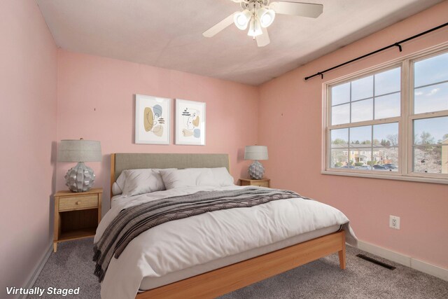 bedroom featuring baseboards, carpet, and visible vents