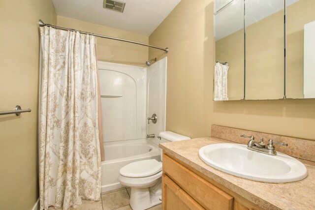 full bathroom with visible vents, tile patterned flooring, vanity, toilet, and shower / bath combo