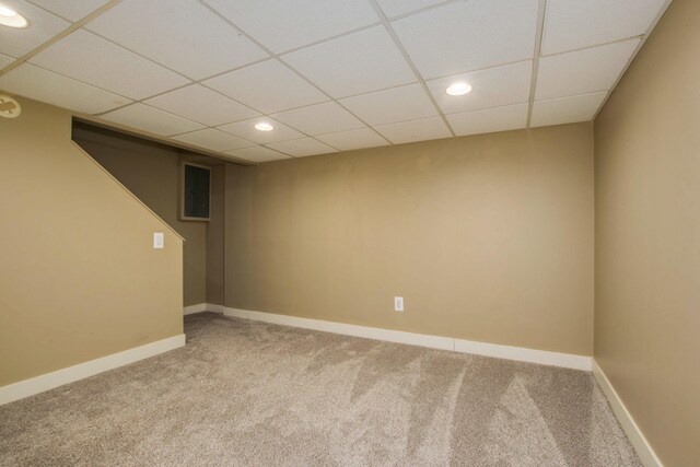 spare room featuring recessed lighting, baseboards, a paneled ceiling, and carpet