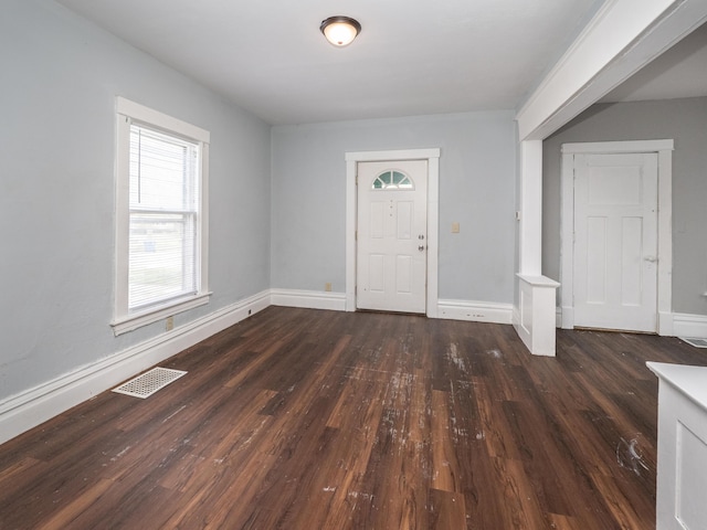 734 Mccourtie St, Kalamazoo, MI 49008 - foyer entrance featuring baseboards, dark wood-style floors, and visible vents
