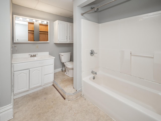 bathroom with vanity, baseboards, toilet, and tub / shower combination