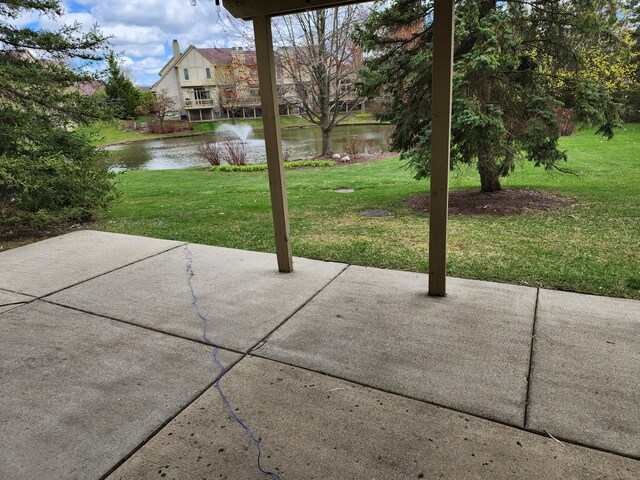 view of patio featuring a water view