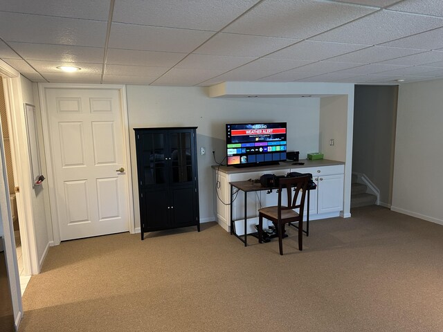bar with stairs, baseboards, light colored carpet, and a drop ceiling