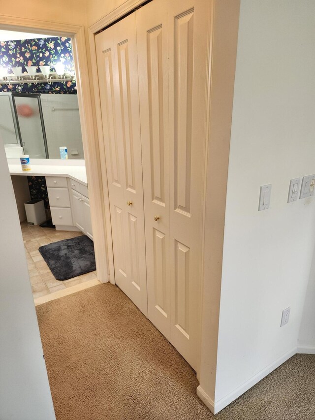 bathroom featuring baseboards and vanity