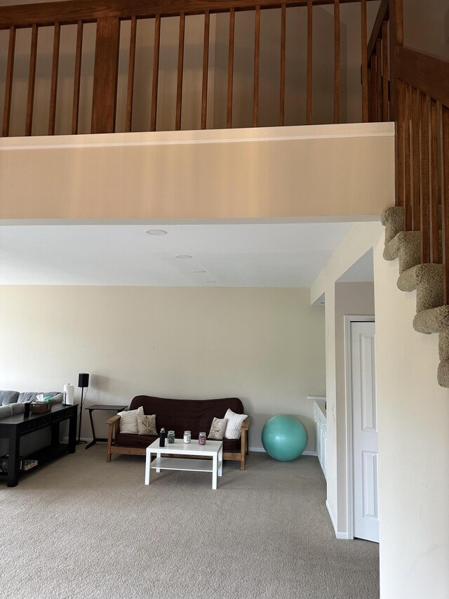 interior space with carpet floors and stairs