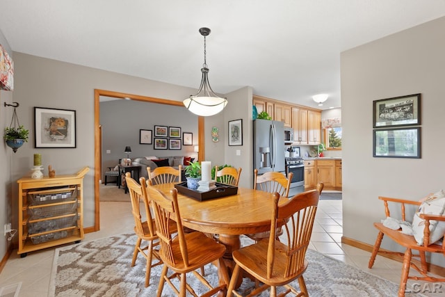 3136 Planeview Dr, Adrian, MI 49221 - dining area with baseboards and light tile patterned floors