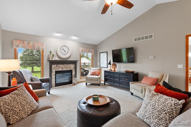 3136 Planeview Dr, Adrian, MI 49221 - carpeted living room featuring high vaulted ceiling, ceiling fan, a fireplace, and visible vents