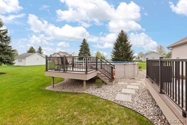 3136 Planeview Dr, Adrian, MI 49221 - view of yard with a deck and an outdoor pool