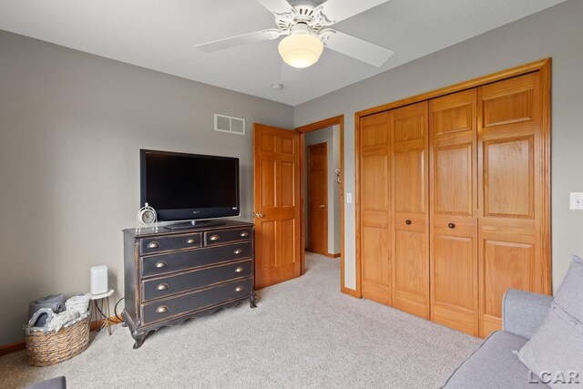 3136 Planeview Dr, Adrian, MI 49221 - bedroom with light colored carpet, a ceiling fan, baseboards, visible vents, and a closet