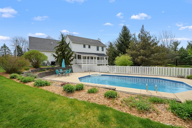 view of swimming pool with fence, stairs, a fenced in pool, a patio area, and a yard