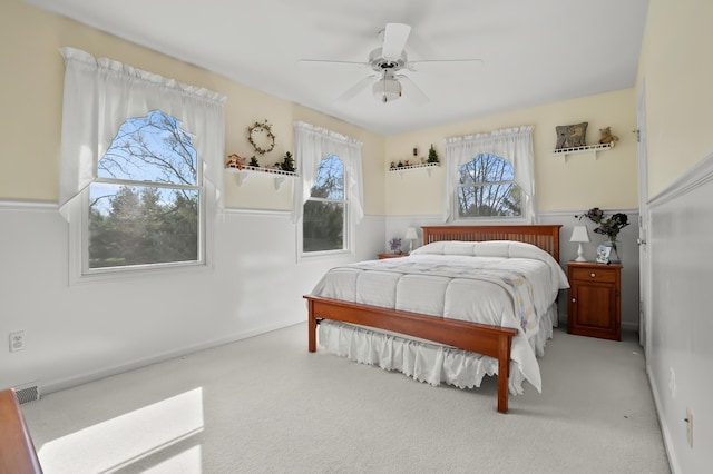 bedroom featuring visible vents, carpet flooring, and ceiling fan