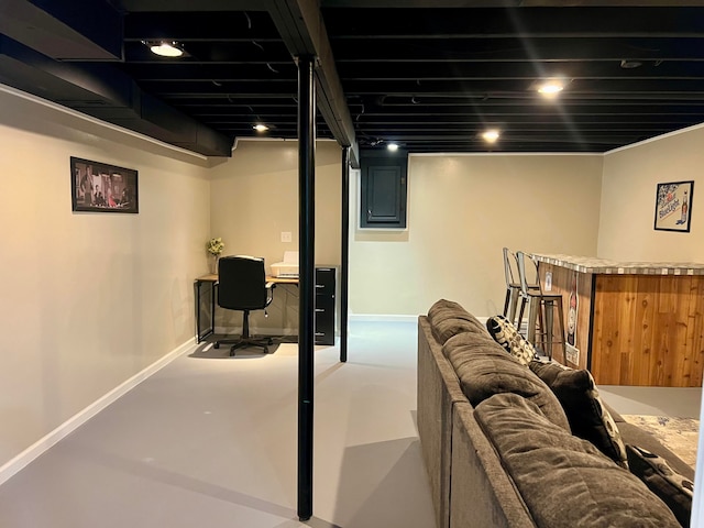 finished below grade area with baseboards and a dry bar