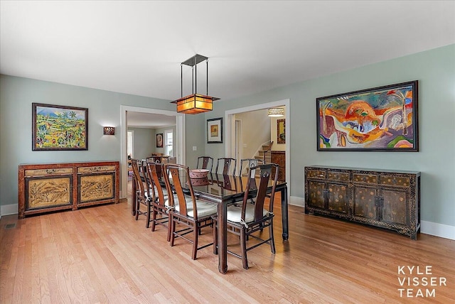 2630 Reeds Lake Ct SE, Grand Rapids, MI 49506 - dining space featuring wood finished floors and baseboards