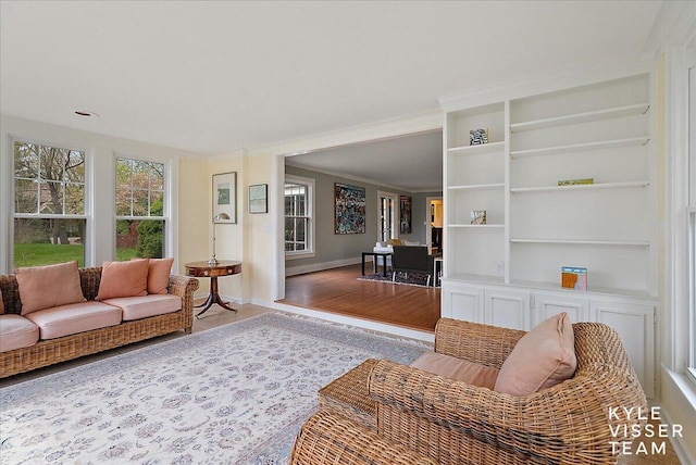 2630 Reeds Lake Ct SE, Grand Rapids, MI 49506 - living room featuring baseboards and built in features
