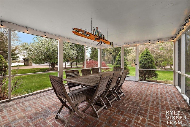 2630 Reeds Lake Ct SE, Grand Rapids, MI 49506 - sunroom with outdoor dining area