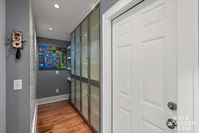 2630 Reeds Lake Ct SE, Grand Rapids, MI 49506 - hallway featuring wood finished floors, recessed lighting, and baseboards