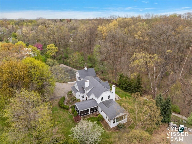 2630 Reeds Lake Ct SE, Grand Rapids, MI 49506 - aerial view of property and surrounding area featuring a heavily wooded area