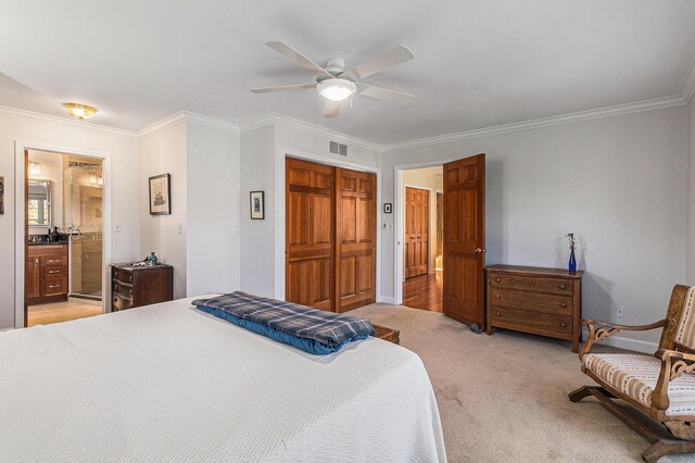bedroom featuring crown molding, baseboards, light colored carpet, and visible vents