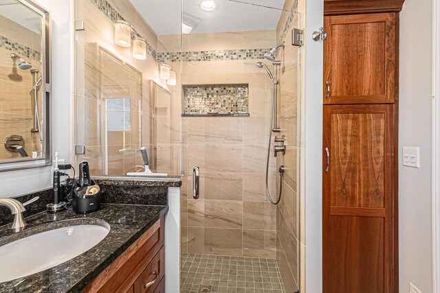 bathroom featuring vanity and a stall shower