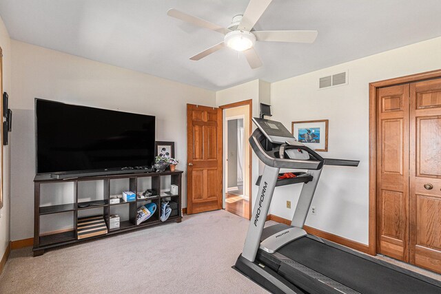 exercise room featuring visible vents, a ceiling fan, baseboards, and carpet