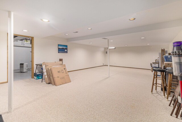 below grade area featuring recessed lighting, carpet, and baseboards