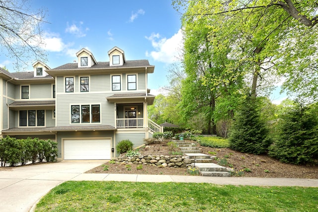 1614 Cambridge Rd, Ann Arbor, MI 48104 - view of front of home featuring stairs, an attached garage, and driveway