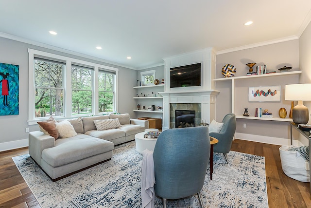 1614 Cambridge Rd, Ann Arbor, MI 48104 - living area with crown molding, wood finished floors, and a tile fireplace