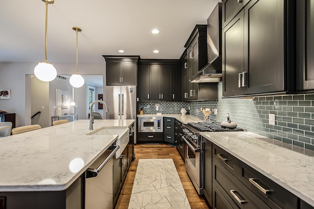 1614 Cambridge Rd, Ann Arbor, MI 48104 - kitchen with premium appliances, light stone counters, dark wood-style floors, and a sink