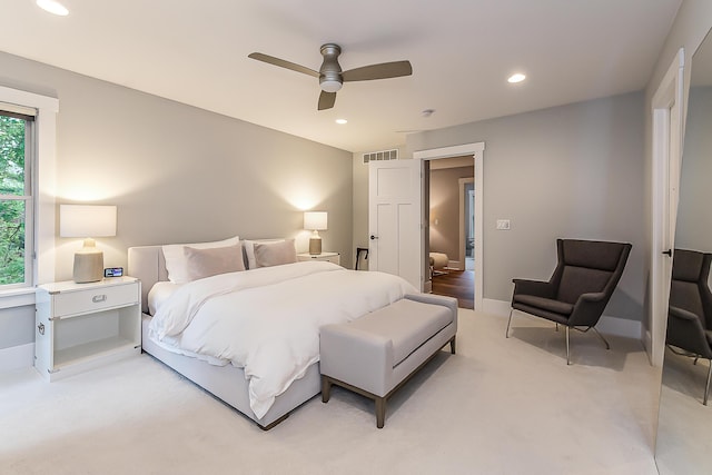 bedroom featuring recessed lighting, light colored carpet, and visible vents
