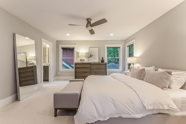 bedroom with baseboards, a ceiling fan, ensuite bathroom, and recessed lighting