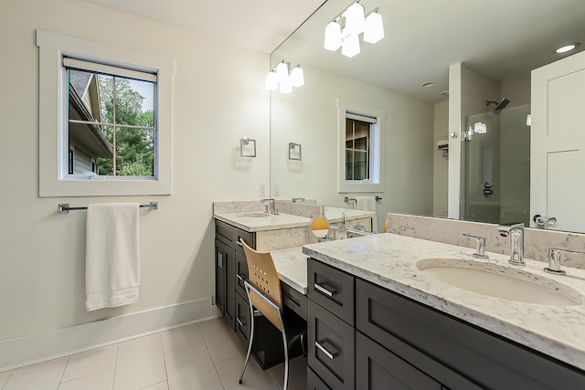 1614 Cambridge Rd, Ann Arbor, MI 48104 - full bathroom with tile patterned floors, baseboards, a shower with shower door, and vanity
