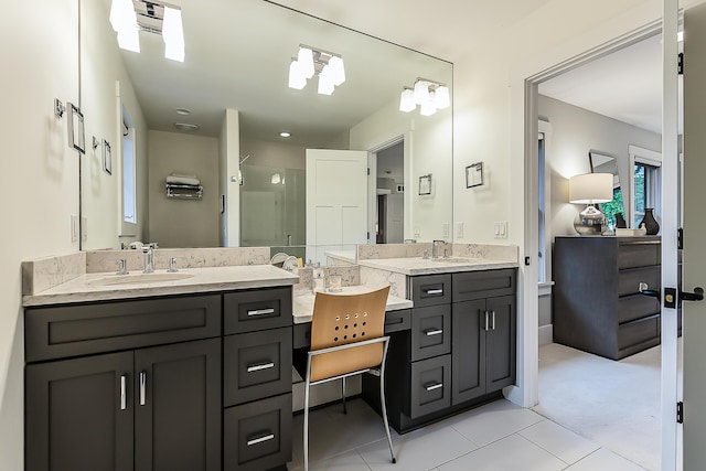 full bath featuring a shower stall, tile patterned flooring, and vanity