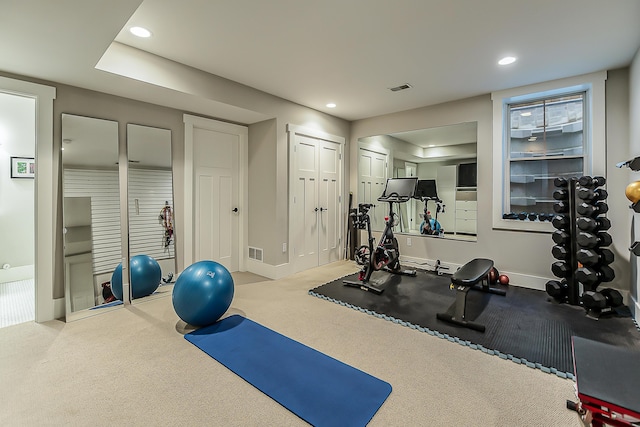 workout area with recessed lighting, baseboards, and visible vents