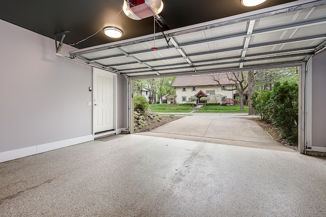 1614 Cambridge Rd, Ann Arbor, MI 48104 - garage featuring a garage door opener