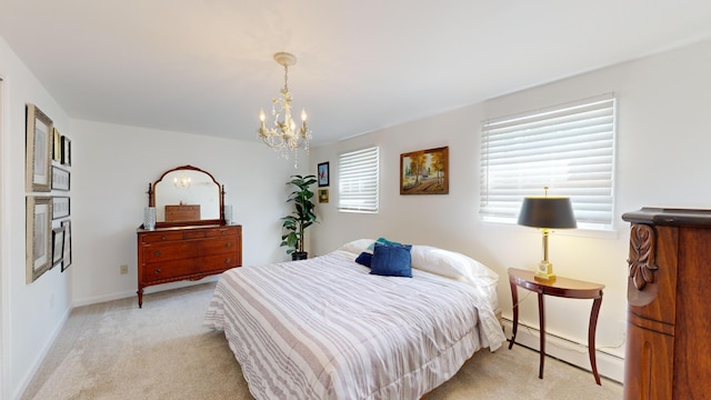 carpeted bedroom featuring baseboards, baseboard heating, and a notable chandelier