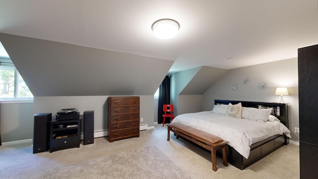 bedroom with baseboard heating, baseboards, light carpet, and lofted ceiling