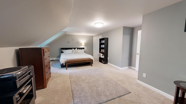bedroom featuring baseboards, light carpet, and a baseboard radiator