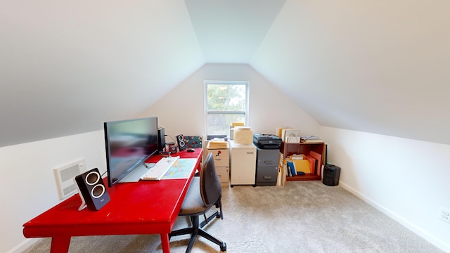 office area featuring light colored carpet, baseboards, and vaulted ceiling