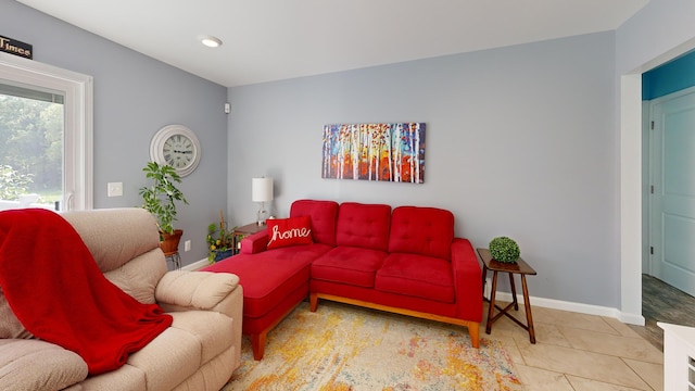 living area with recessed lighting and baseboards