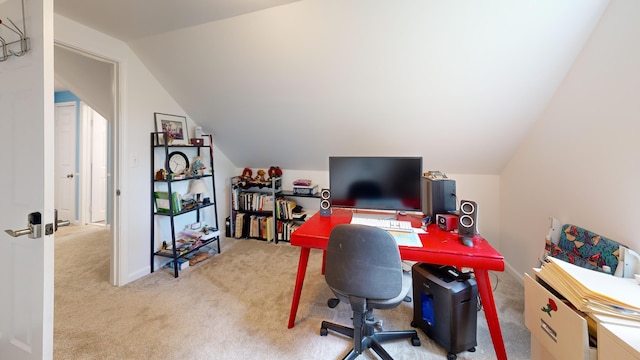 office space featuring carpet flooring and vaulted ceiling