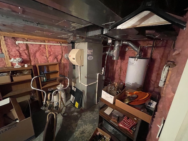 utility room featuring heating unit and gas water heater