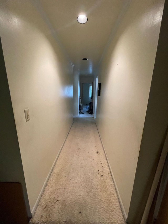 hall featuring recessed lighting, baseboards, and carpet